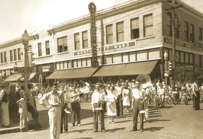 Members of the Hickman High School Band standing in front of the Virginia Building in downtown Columbia.
